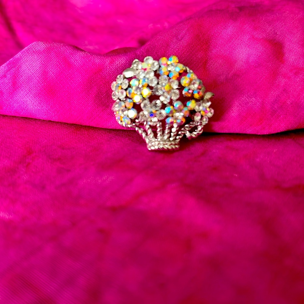 Silver tone basket of sparkling flowers